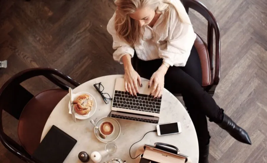 Woman at desk analyzing AI job security risk 2026