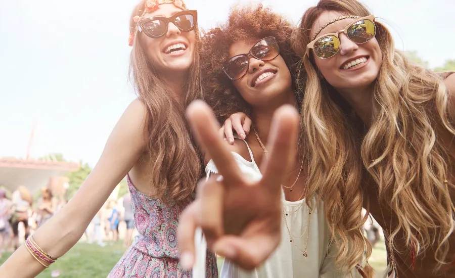 group of three women enjoying the moment outdoors