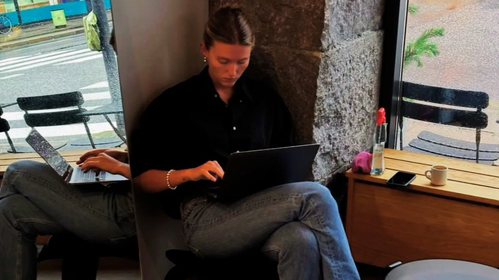 woman working on her laptop in a public space