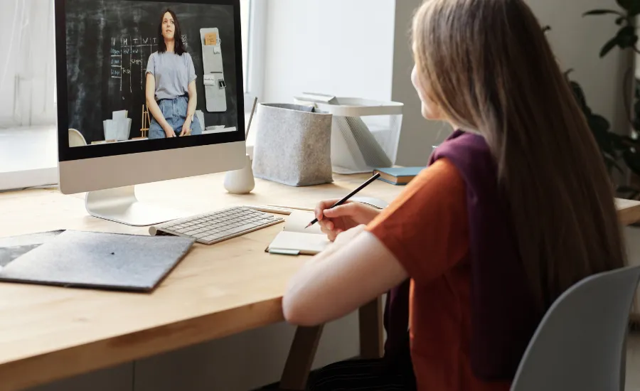 woman watching crime documentary on desktop